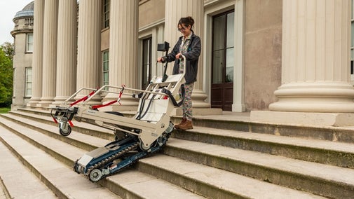 Woman demonstrating the stairclimber at Shugborough Estate